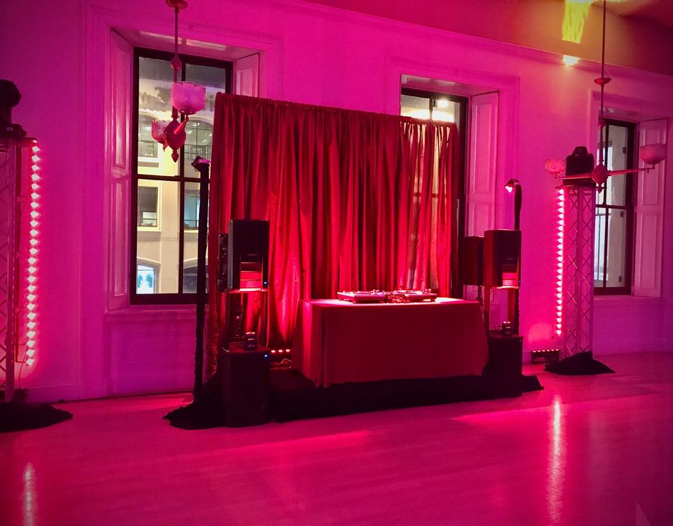 DJ setup in a red wash, Party
